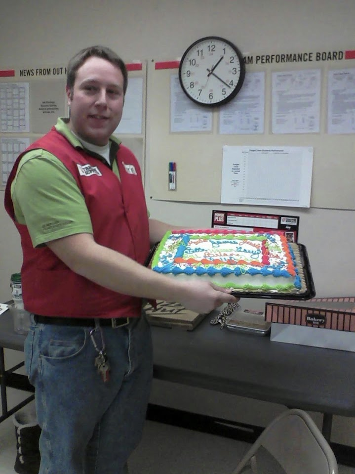 Chris Brennan celebrating with a cake during his Tractor Supply career